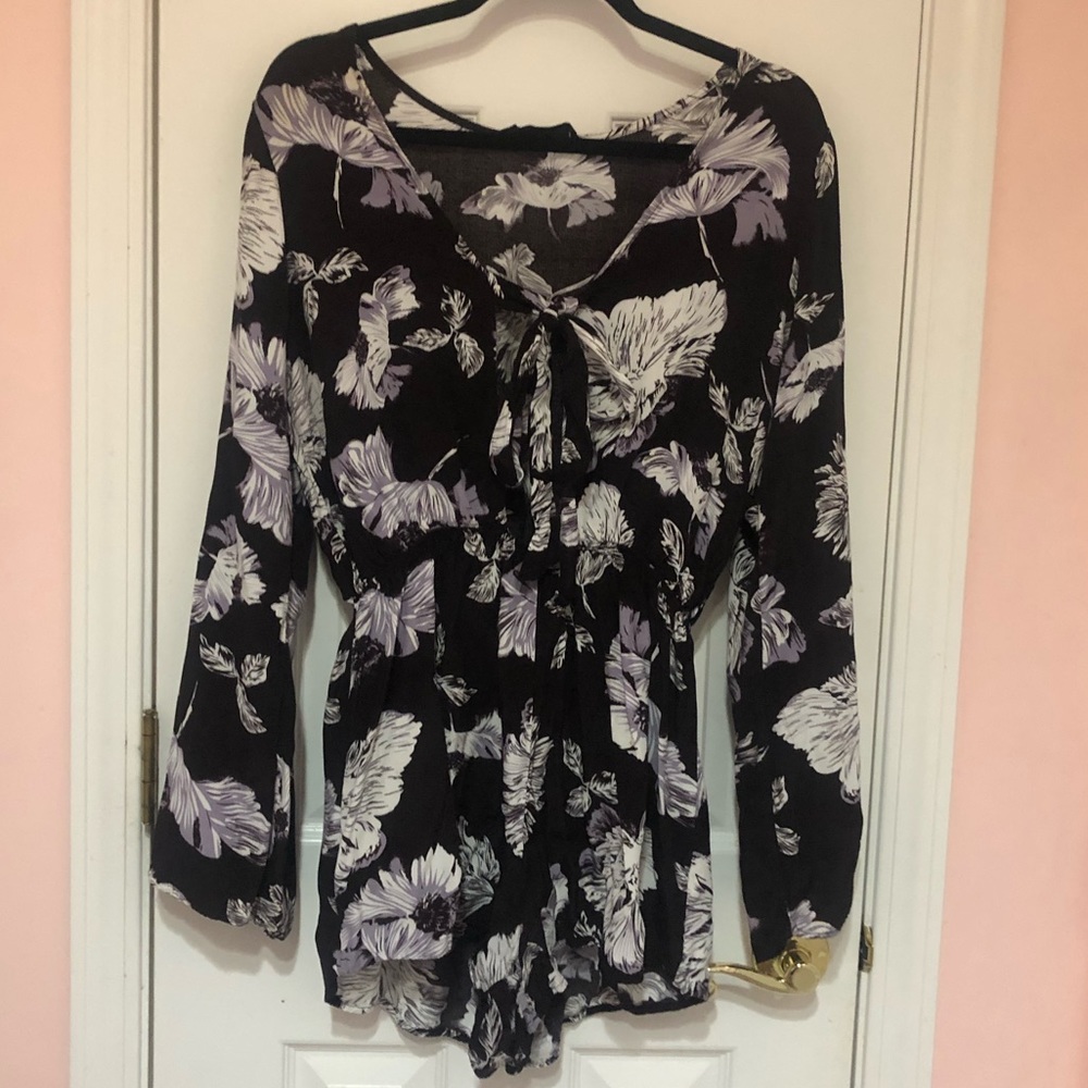Black floral longsleeve romper with a tie in front